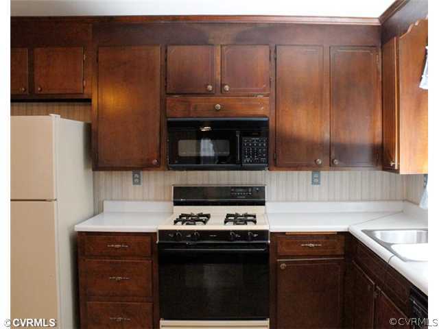 216 Chasnell Road Chesterfield, VA 23236 - Photo 6 of 23 a kitchen with a sink stove and microwave
