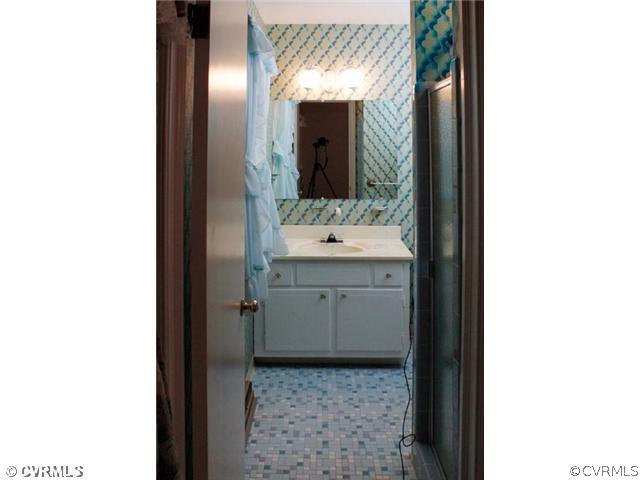 216 Chasnell Road Chesterfield, VA 23236 - Photo 8 of 23 a bathroom with a sink and a mirror
