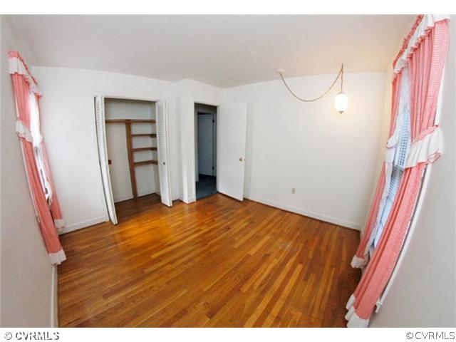 216 Chasnell Road Chesterfield, VA 23236 - Photo 9 of 23 a view of empty room with wooden floor