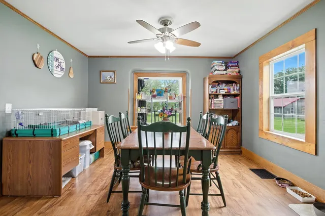 a view of a dining room with furniture window and wooden floor