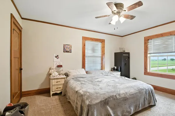 a bed room with a bed and a chandelier