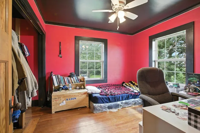 a bedroom with a bed and a dresser