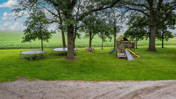 a view of a deck with chairs and a yard
