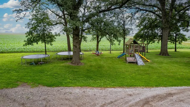 a view of a deck with chairs and a yard