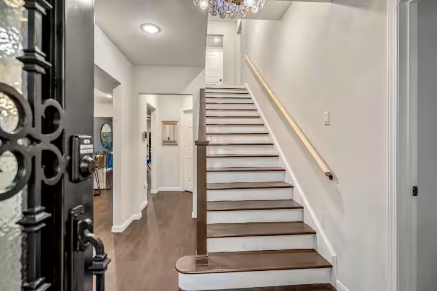 3741 Charleston Street Houston, TX 77021 - Photo 8 of 37 Step inside the foyer and you will find the dining area and kitchen on the left and a bedroom with ensuite bath on the right.