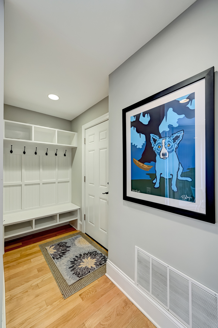 1208 Indian Trail Road, Unit 3E Hinsdale, IL 60521 - Photo 16 of 24 a view of a hallway with paintings on the wall