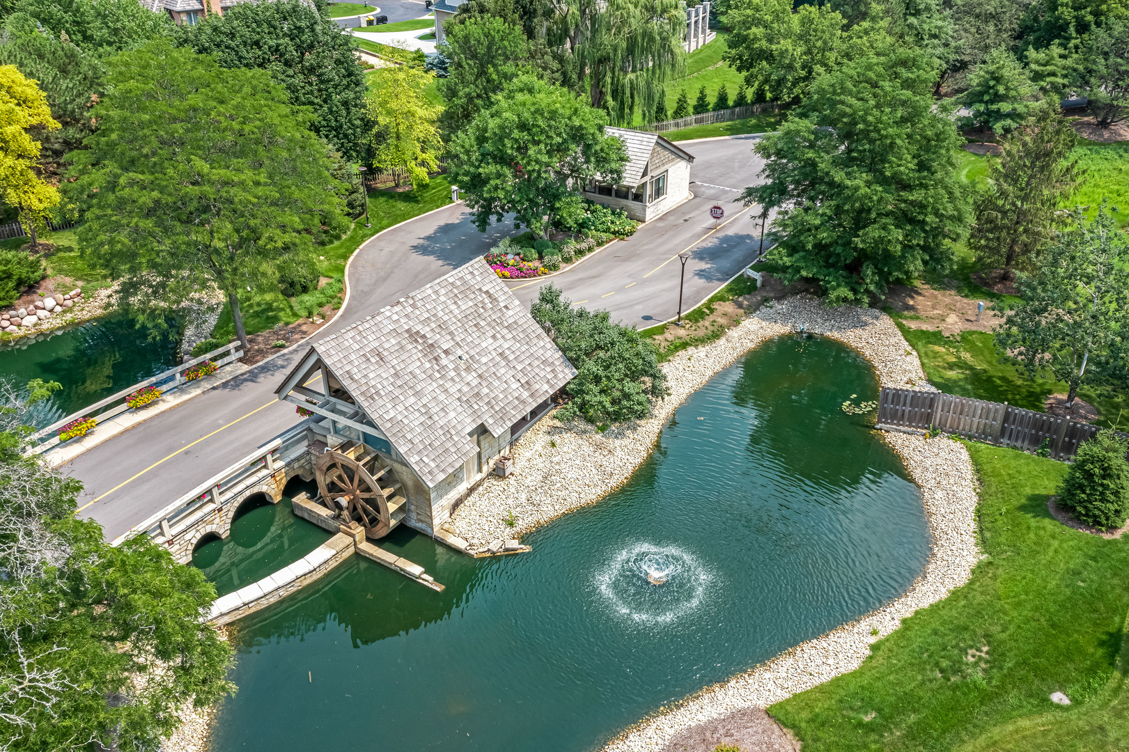 1208 Indian Trail Road, Unit 3E Hinsdale, IL 60521 - Photo 23 of 24 an aerial view of a house with a yard and lake view