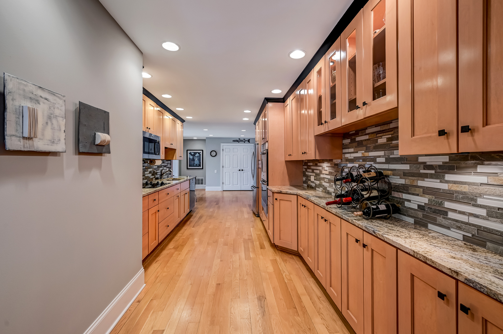 1208 Indian Trail Road, Unit 3E Hinsdale, IL 60521 - Photo 8 of 24 a large kitchen with stainless steel appliances granite countertop a lot of counter space and wooden floor