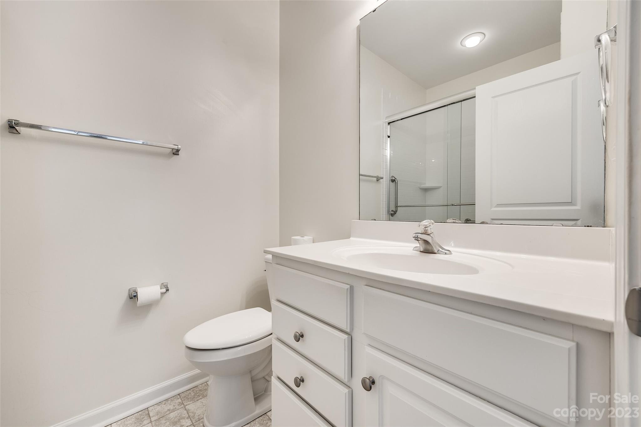 958 Copperstone Lane Fort Mill, SC 29708 - Photo 11 of 29 a bathroom with a sink a toilet and a mirror