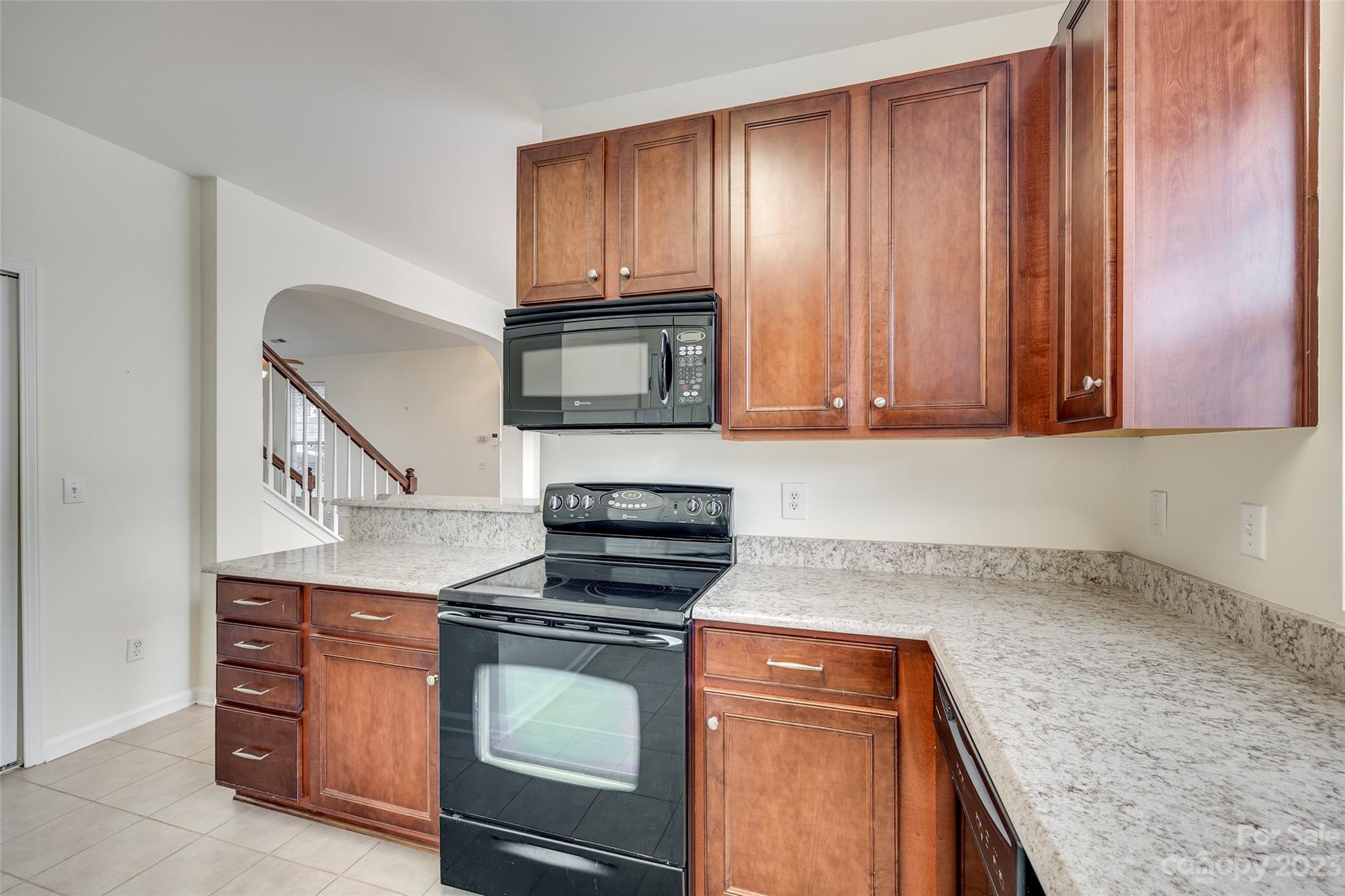 958 Copperstone Lane Fort Mill, SC 29708 - Photo 16 of 29 a kitchen with a stove and a microwave