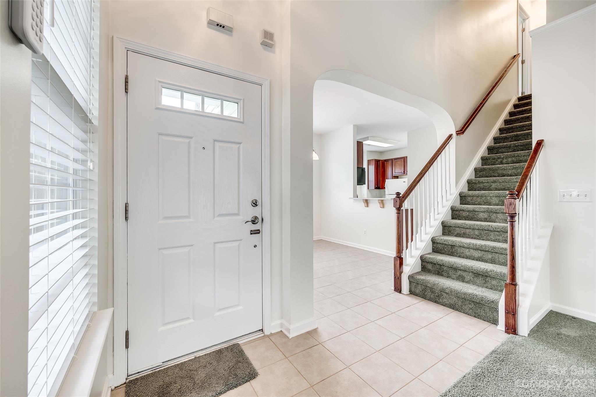 958 Copperstone Lane Fort Mill, SC 29708 - Photo 4 of 29 a view of a hallway with entryway wooden floor and front door