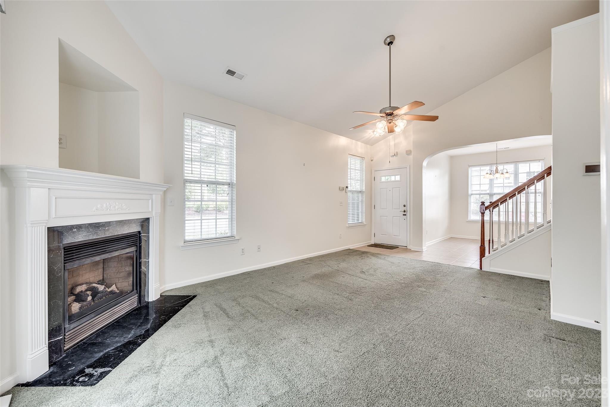 958 Copperstone Lane Fort Mill, SC 29708 - Photo 5 of 29 a view of an empty room with a fireplace and a window