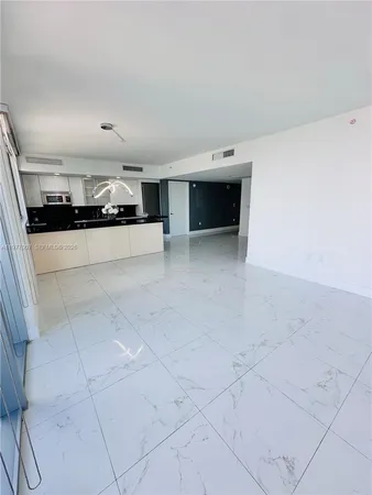 a view of empty room with floor to ceiling window