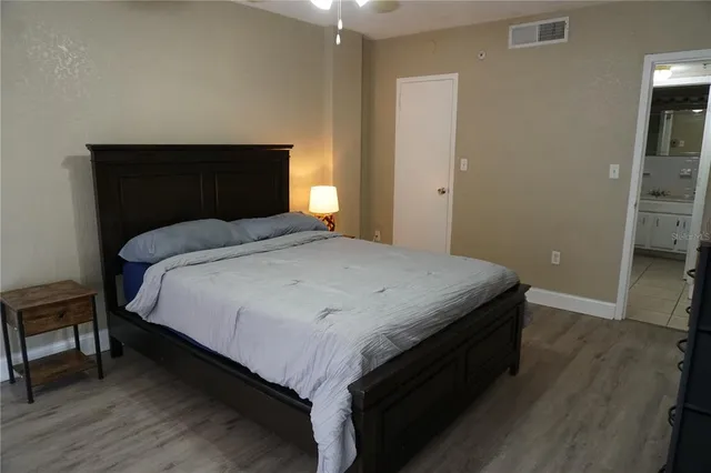 a bedroom with a bed and a table