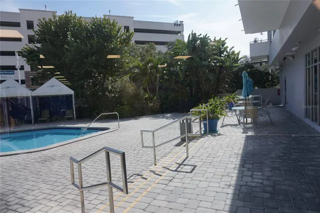 a view of a backyard with sitting area