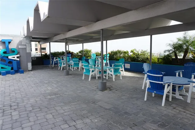 an aerial view of a house with a yard and lake view