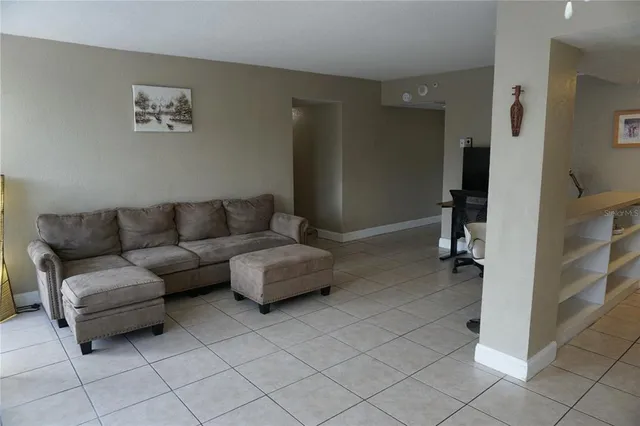 a living room with furniture and a rug