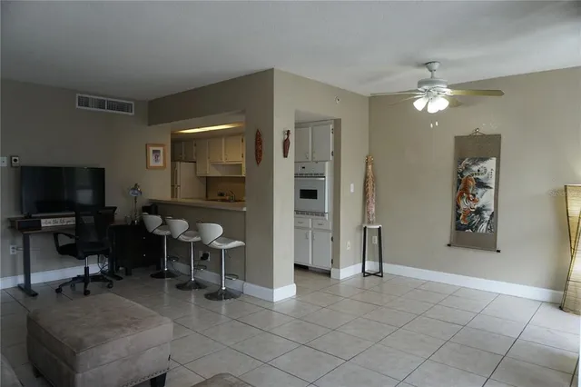 a view of a livingroom with furniture and a flat screen tv