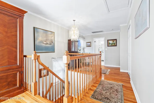 a view of a balcony with wooden floor and fence