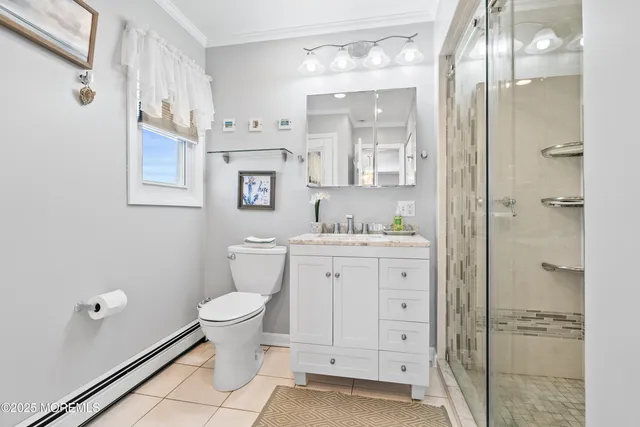 a bathroom with a granite countertop sink mirror and shower
