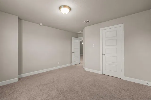 an empty room with closet area