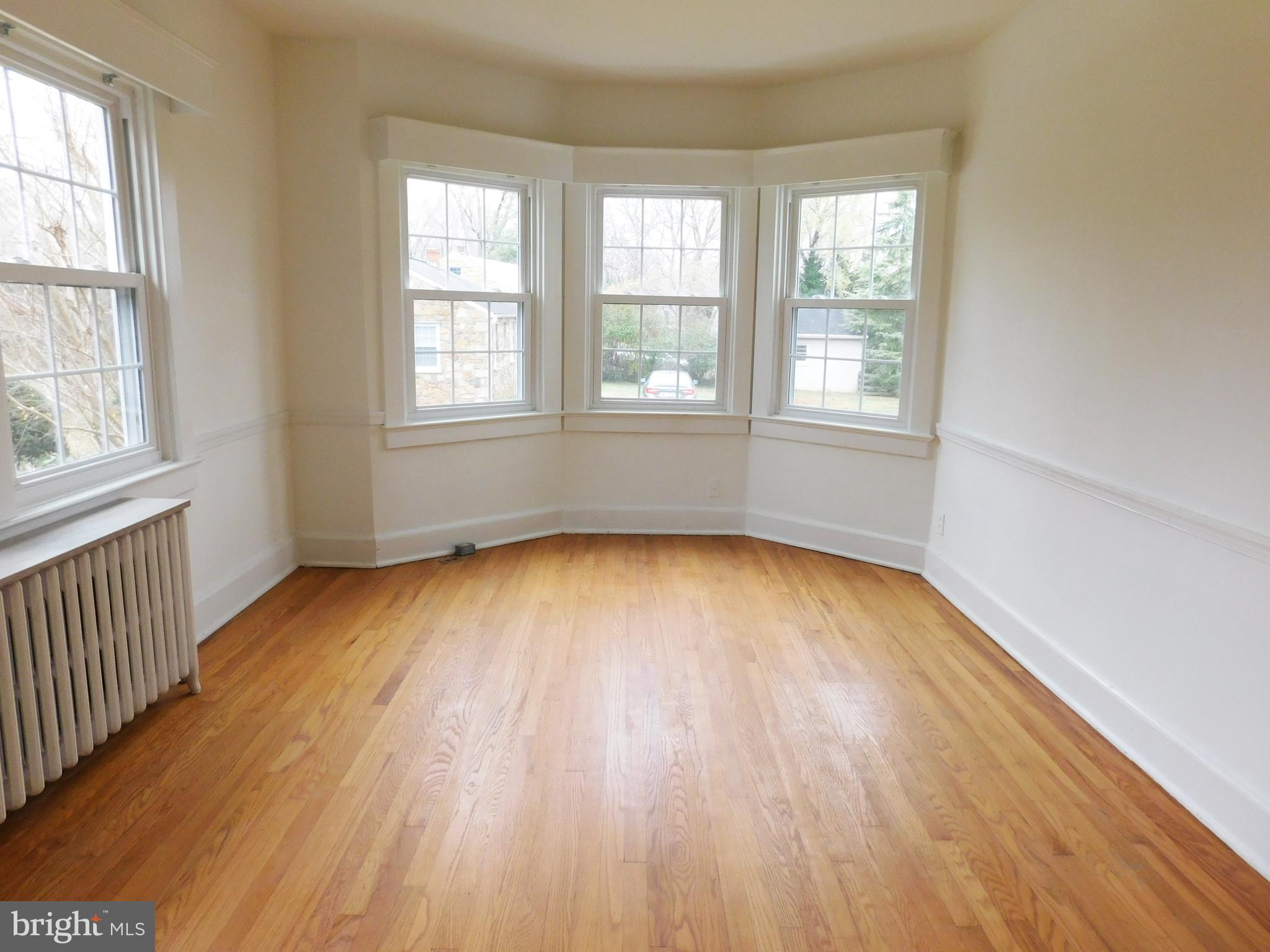 641 Old Meetze Road Warrenton, VA 20186 - Photo 4 of 15 an empty room with wooden floor and windows