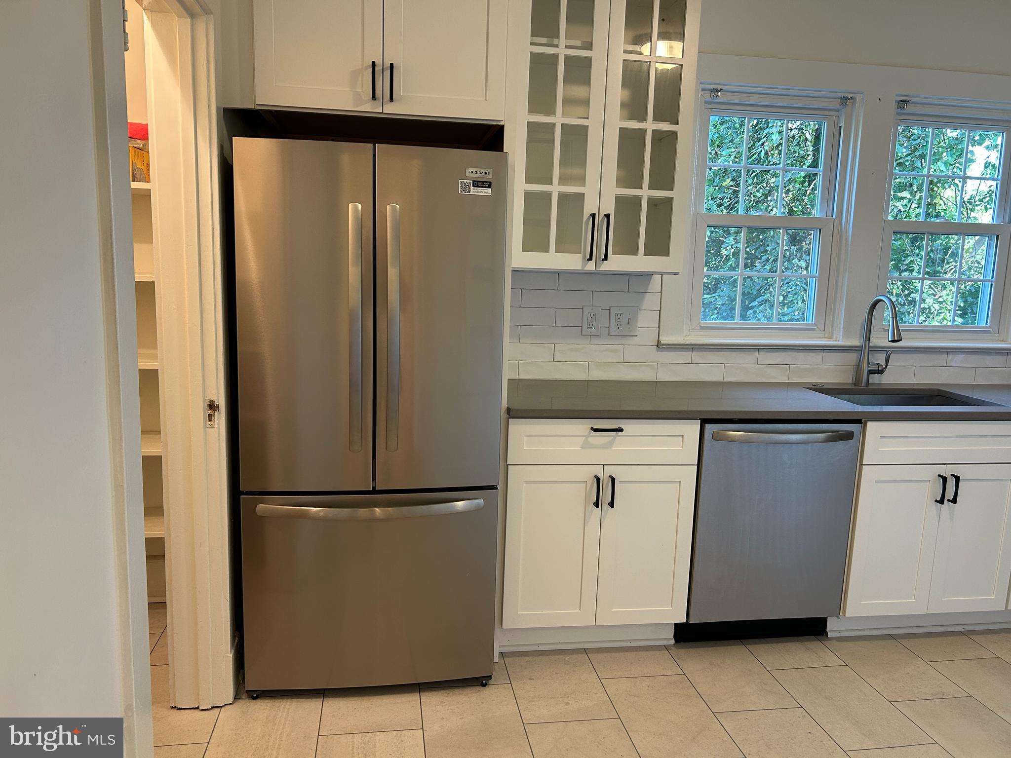 641 Old Meetze Road Warrenton, VA 20186 - Photo 5 of 15 a kitchen with stainless steel appliances granite countertop a refrigerator and a sink