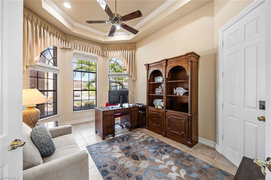 146 Windward Cay Naples, FL 34114 - Photo 18 of 33 a living room with furniture and a window