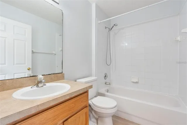 a bathroom with a sink toilet tub and shower