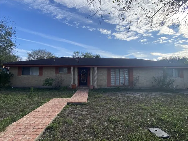 a view of a backyard with large trees