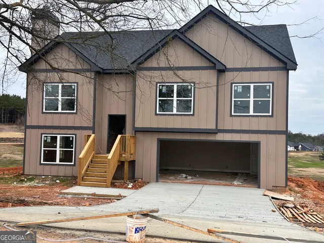 a front view of a house with a garage