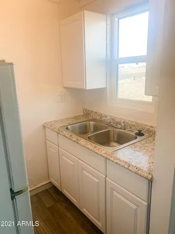 a view of a sink and microwave