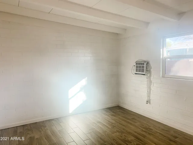 a view of an empty room and window
