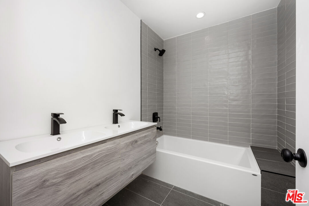 5627 Agnes Avenue Valley Village, CA 91607 - Photo 7 of 11 a bathroom with a bathtub and a sink