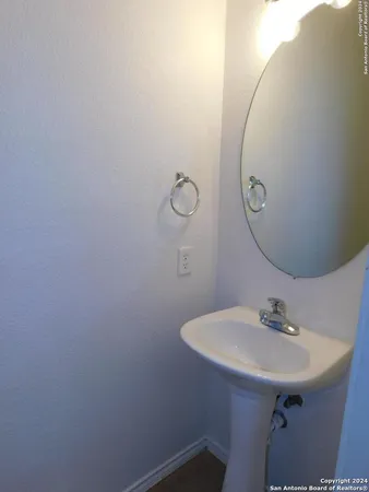 a bathroom with a sink and mirror