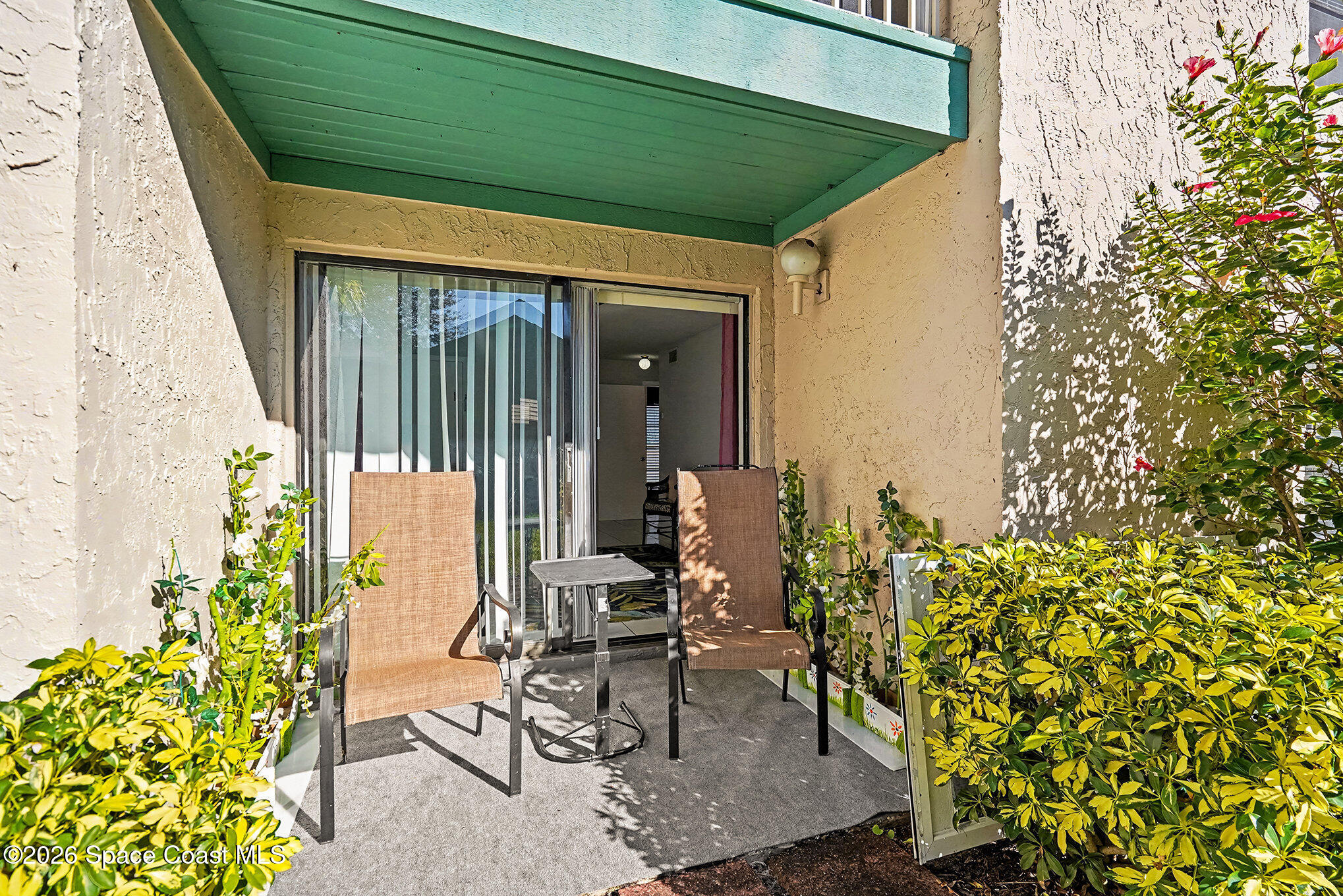 1225 North Wickham Road, Unit 411 Melbourne, FL 32935 - Photo 22 of 26 a view of porch with seating space