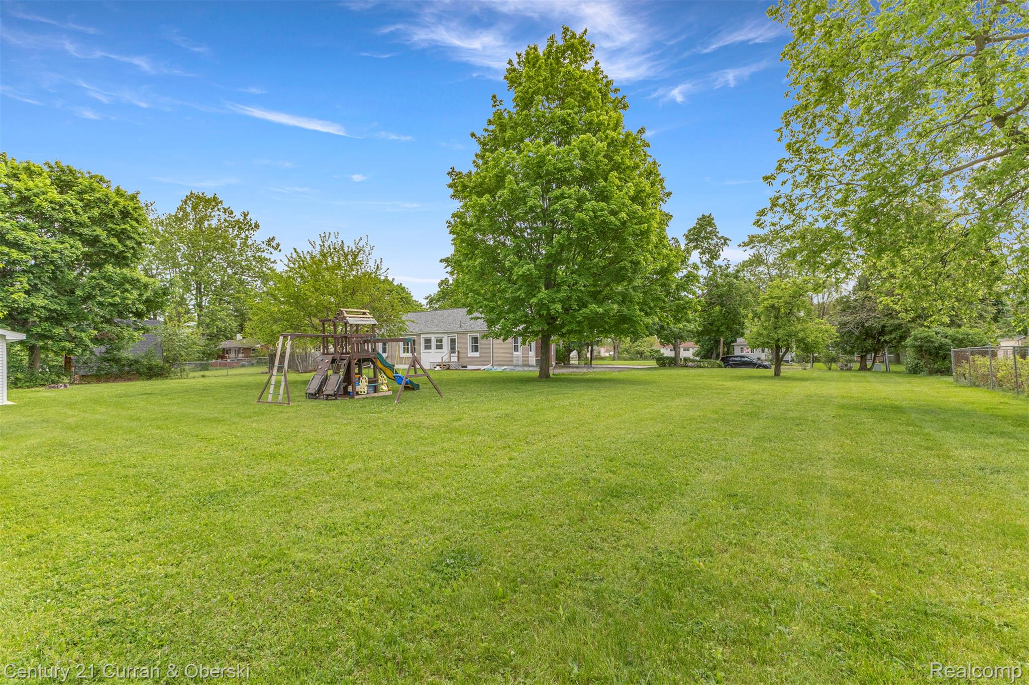 411 South Adrian Street Tecumseh, MI 49286 - Photo 44 of 61 View of yard with a playground