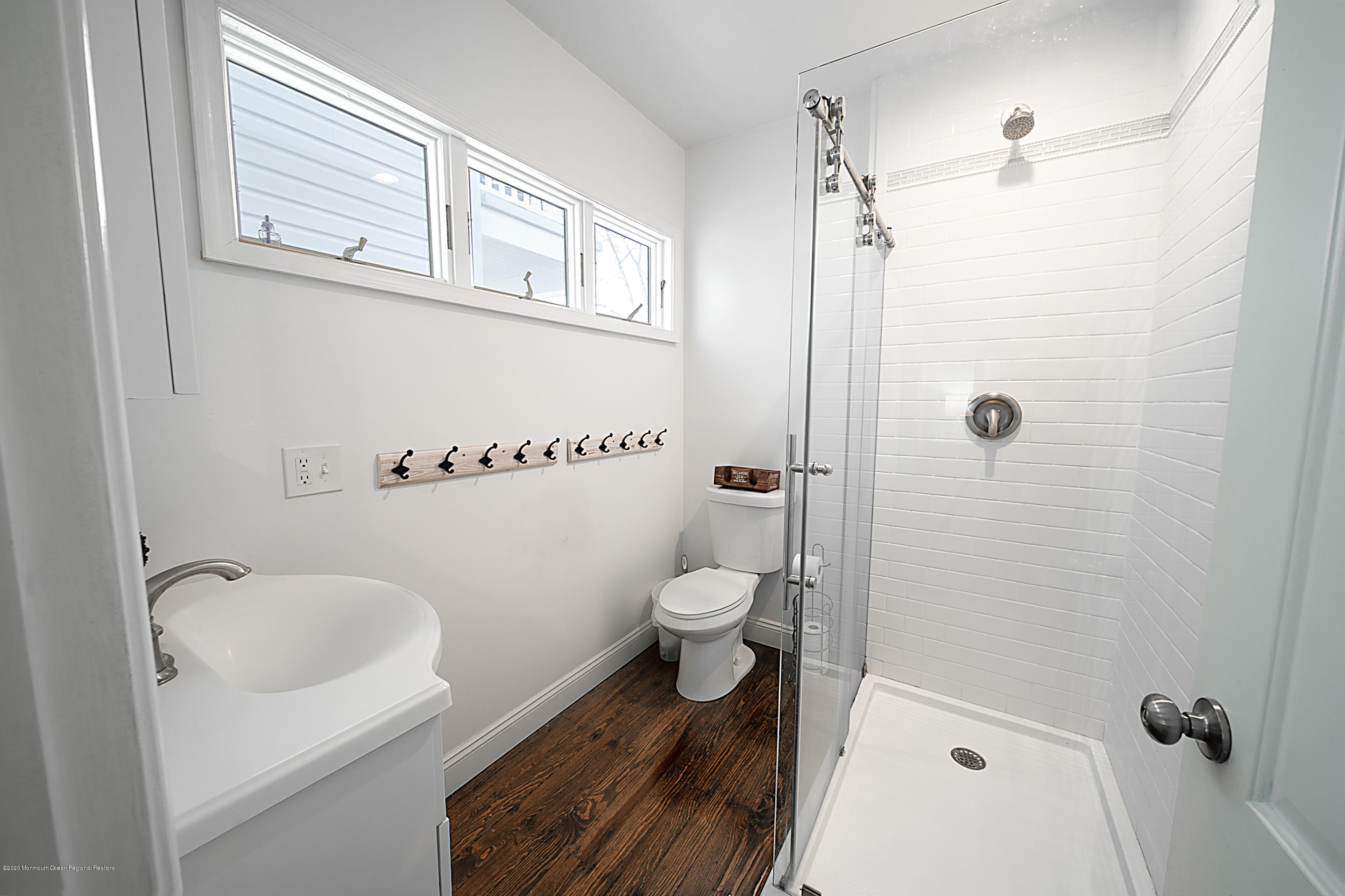 22 Cornwall Street Highlands, NJ 07732 - Photo 12 of 24 a bathroom with a toilet a sink and shower