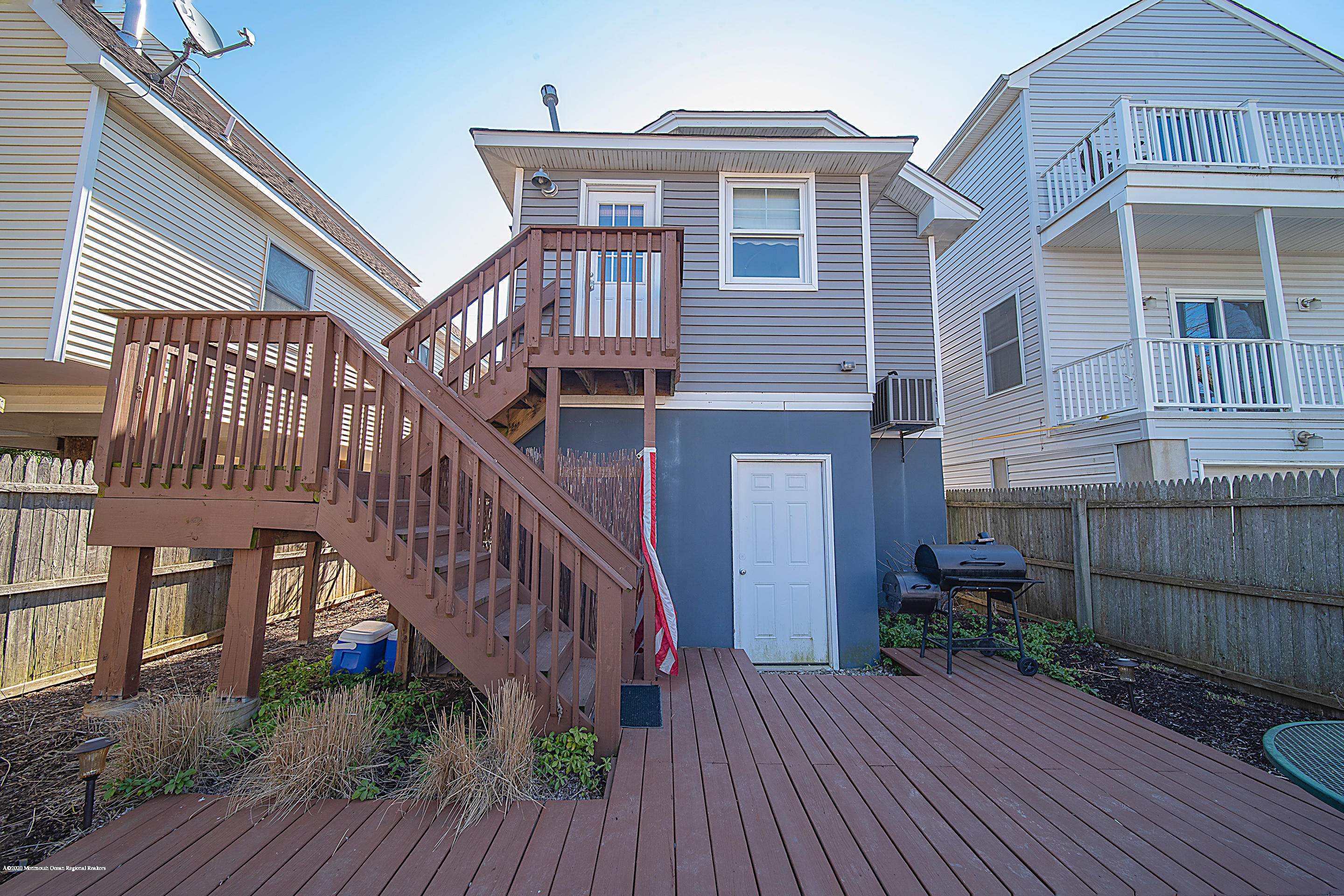 22 Cornwall Street Highlands, NJ 07732 - Photo 17 of 24 a view of a house with wooden deck stairs and wooden floor