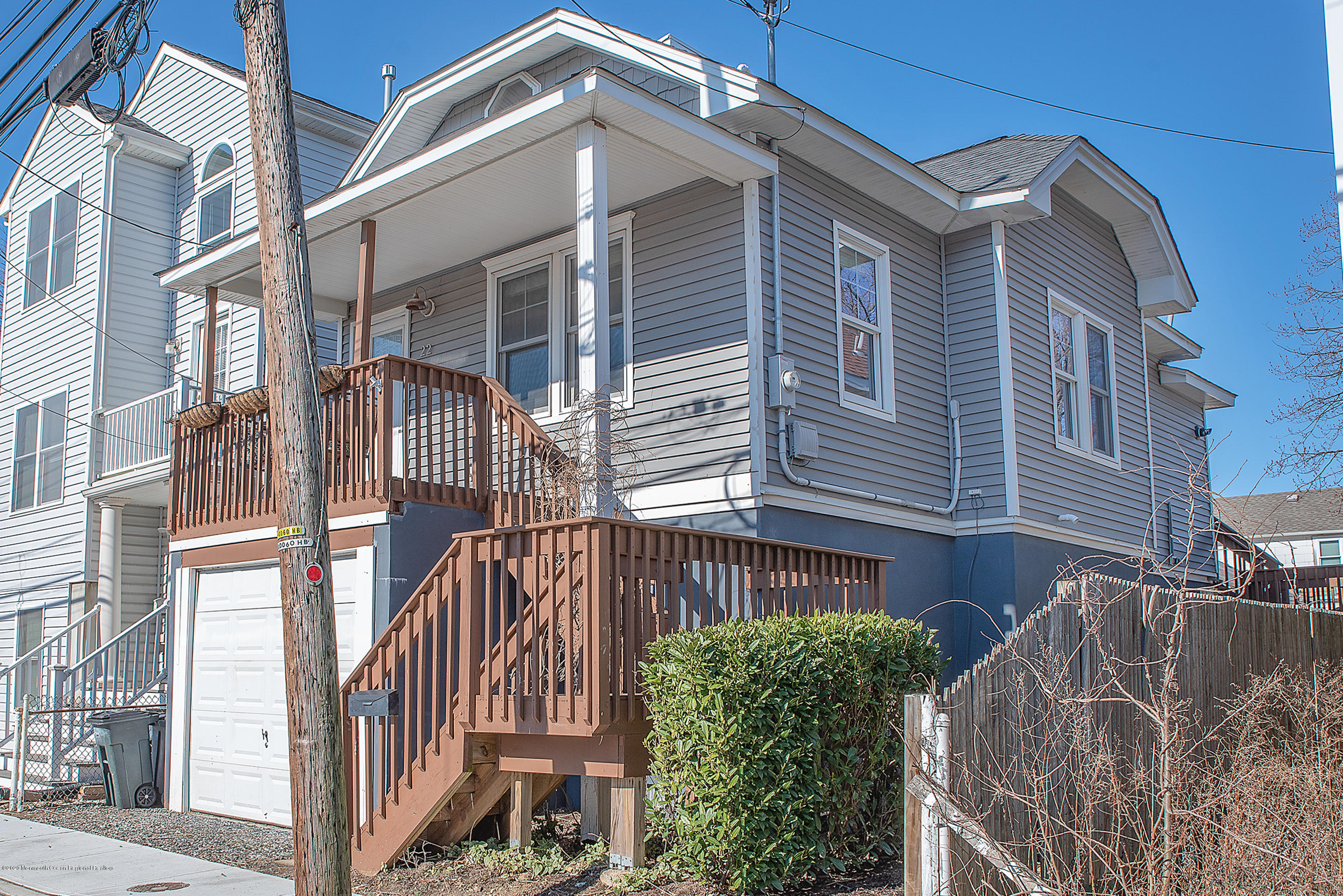 22 Cornwall Street Highlands, NJ 07732 - Photo 22 of 24 a front view of a house with a yard