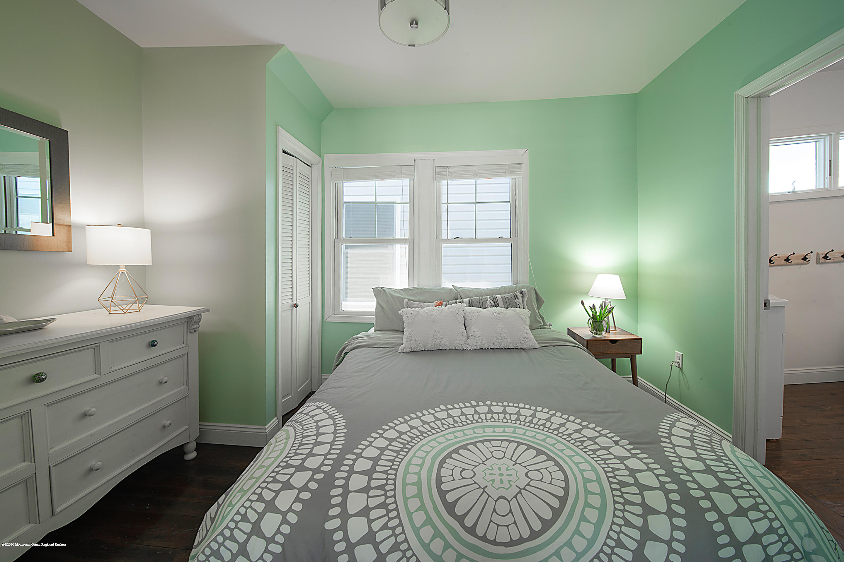 22 Cornwall Street Highlands, NJ 07732 - Photo 10 of 24 a bedroom with a large bed and a window