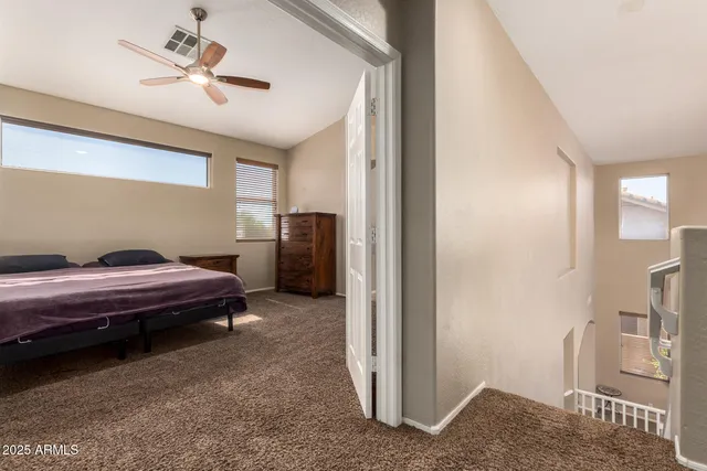 a bedroom with a bed dresser and a window