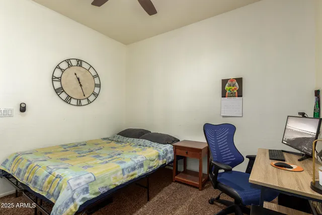 a workspace with furniture and book shelf