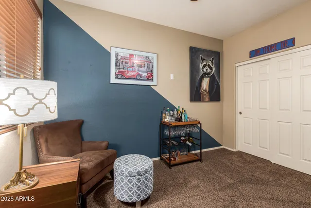 a living room with furniture and gym equipment