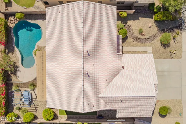 an aerial view of residential houses with outdoor space