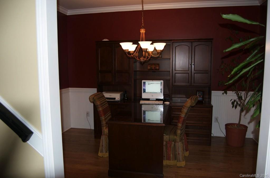 190 Kimberly Road Davidson, NC 28036 - Photo 15 of 21 a view of a hallway with wooden floor and staircase