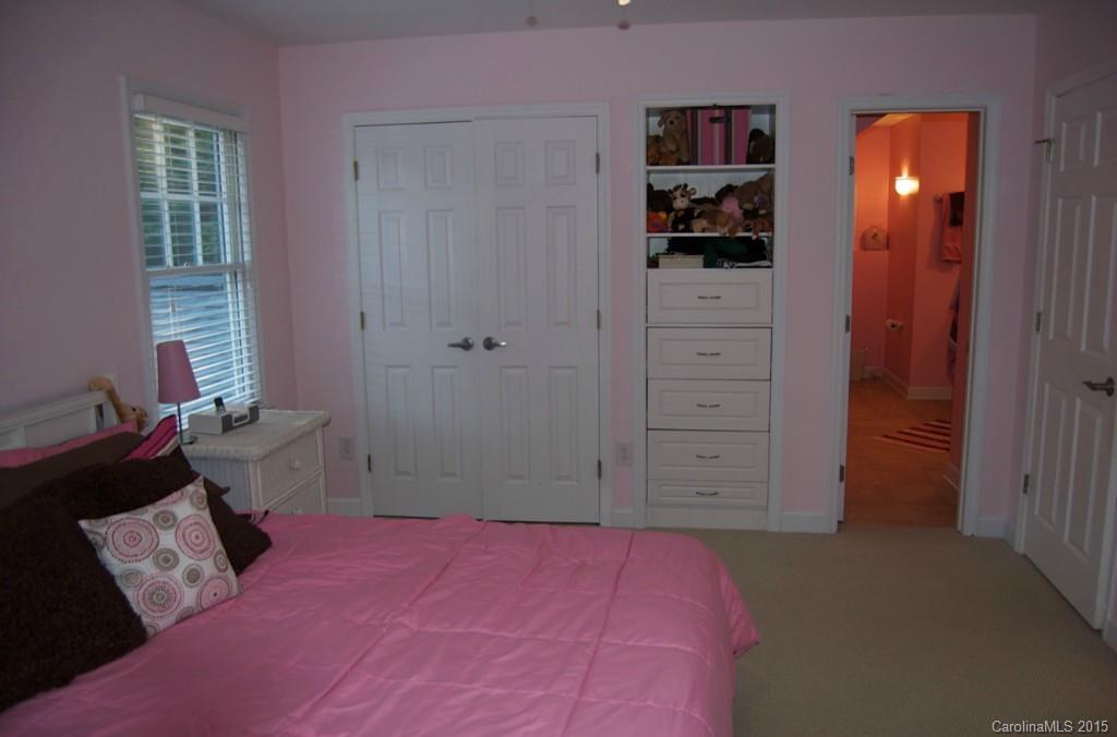 190 Kimberly Road Davidson, NC 28036 - Photo 19 of 21 a bedroom with a bed and a mirror