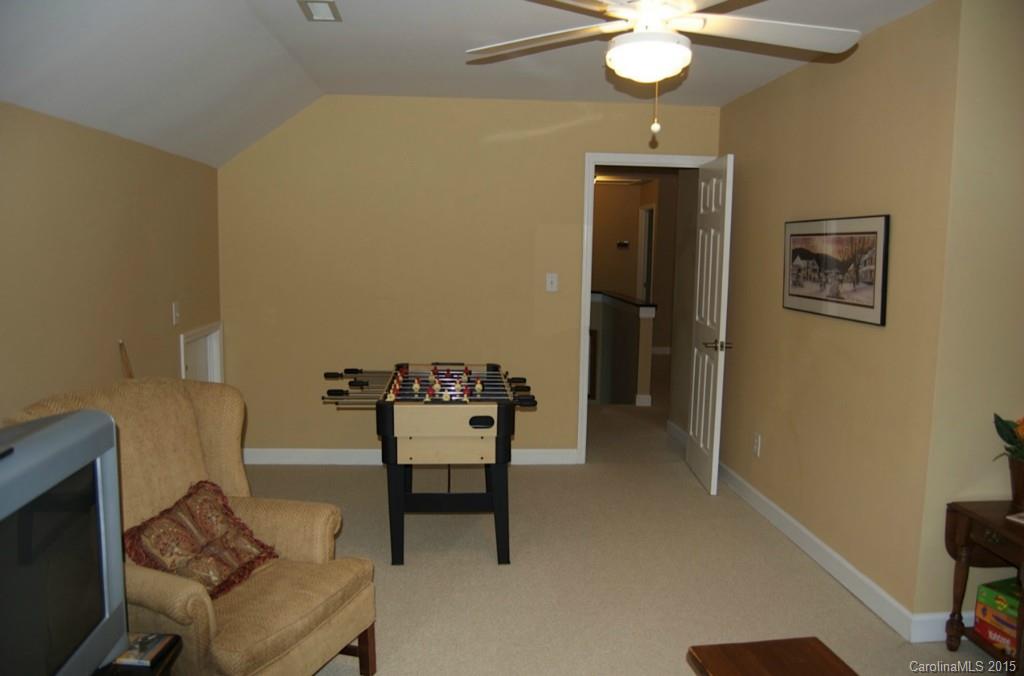 190 Kimberly Road Davidson, NC 28036 - Photo 20 of 21 a dining room with furniture and a chandelier fan