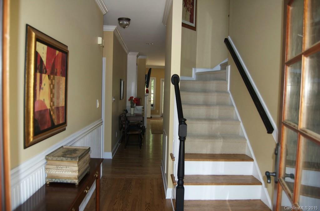 190 Kimberly Road Davidson, NC 28036 - Photo 5 of 21 a view of a hallway with wooden floor and staircase