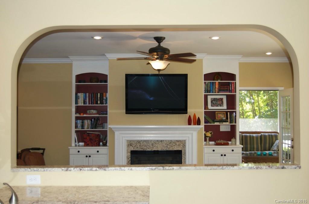 190 Kimberly Road Davidson, NC 28036 - Photo 7 of 21 a living room with furniture and a fireplace